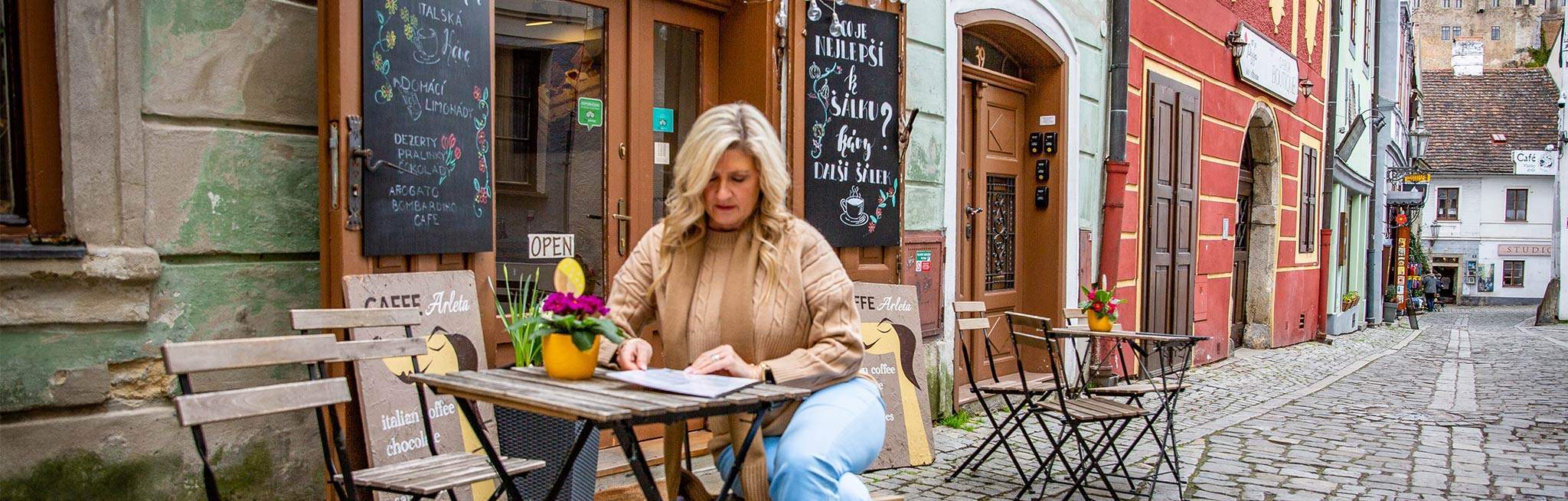 A woman working outside a cafe